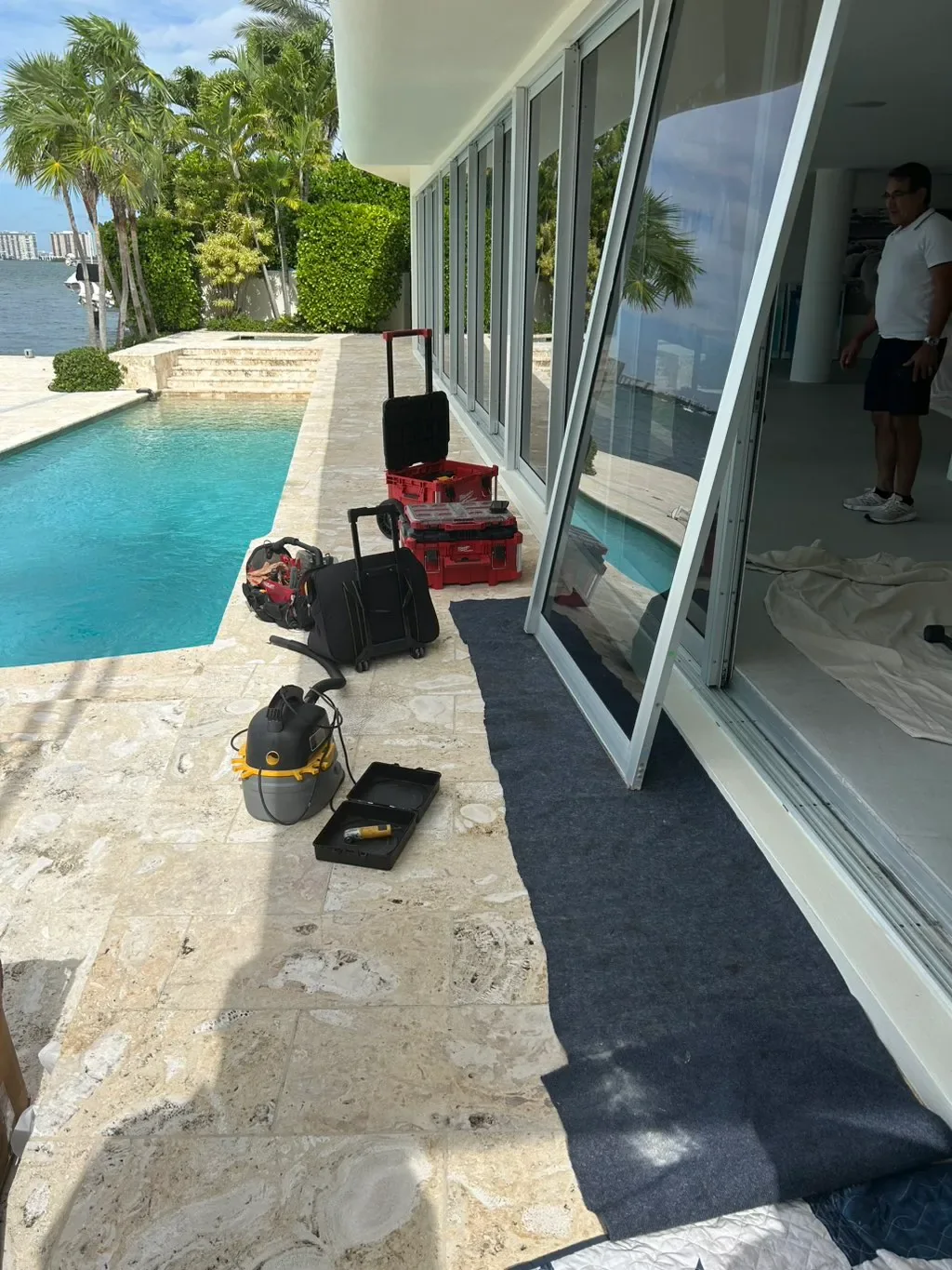 Patio slider serviced at a rental home by a pool
