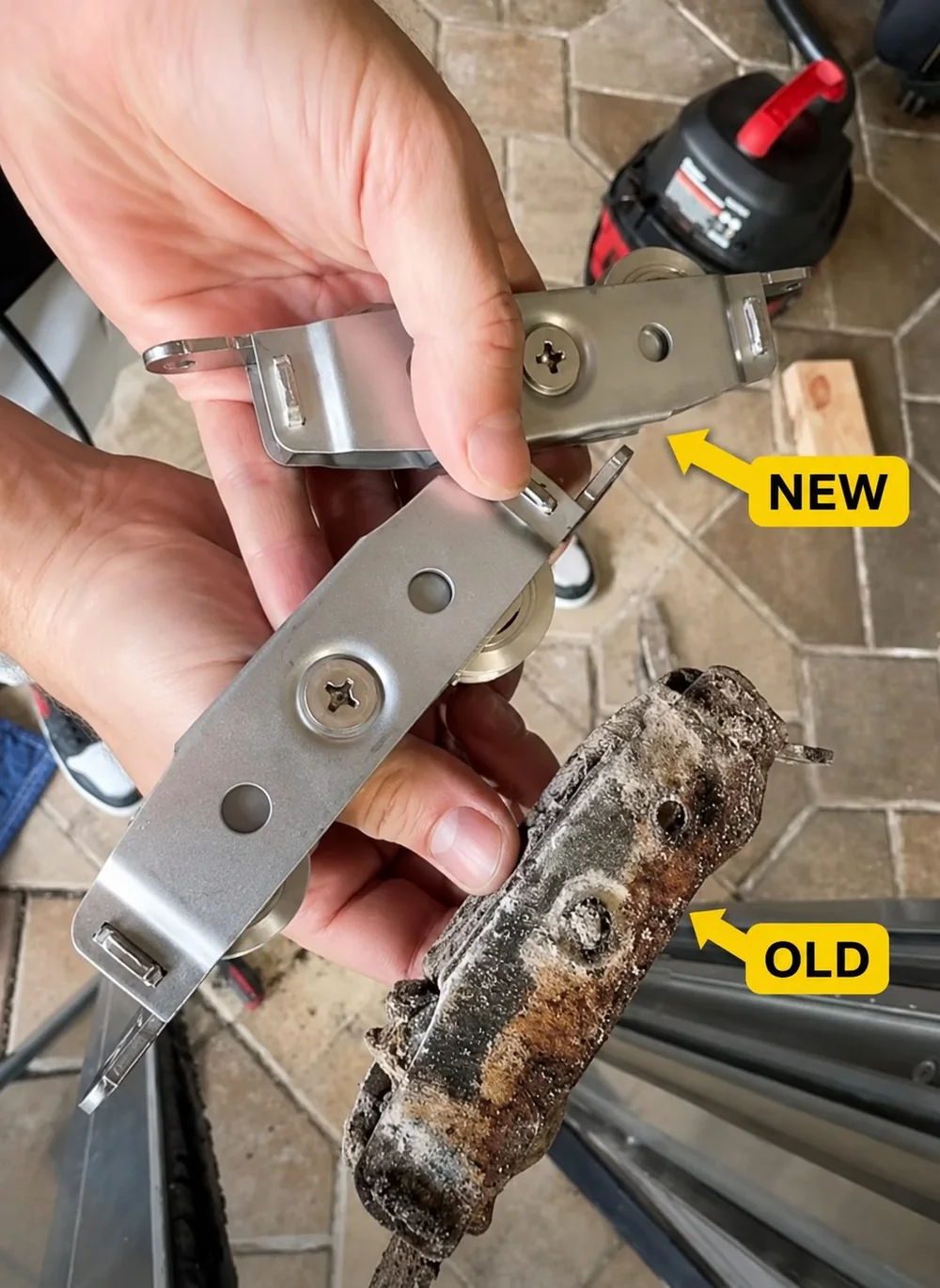 A new sliding door roller next to a worn old roller