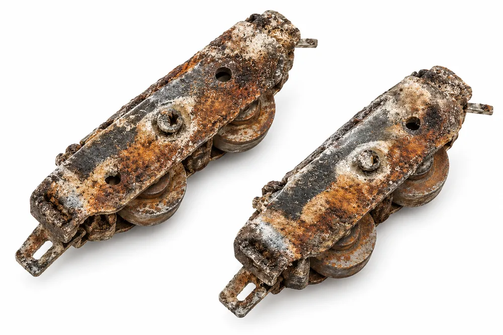 Pair of rusted sliding door rollers