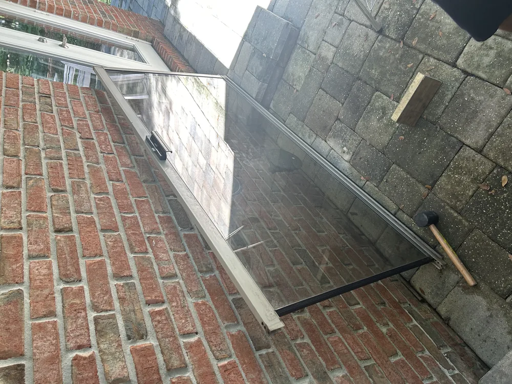 Sliding door track along a brick patio